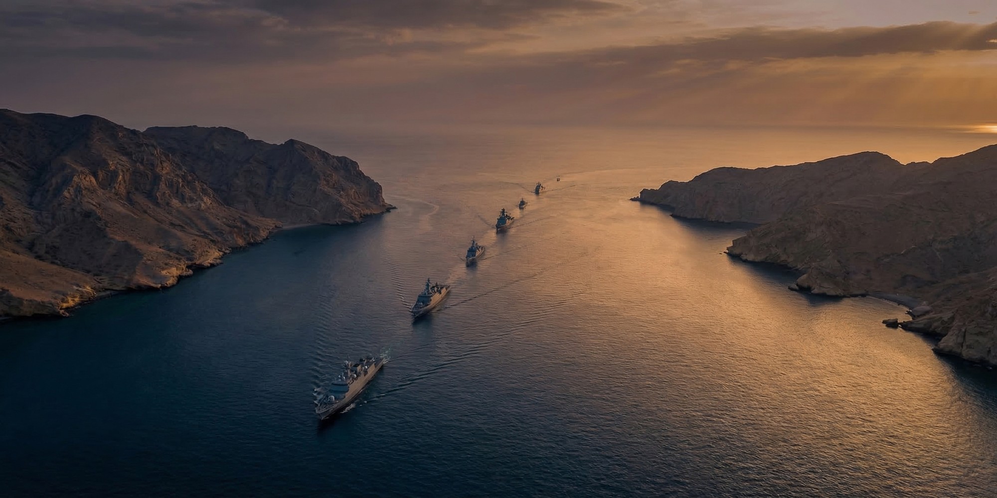 Aerial view of the Strait of Hormuz waterway at dusk